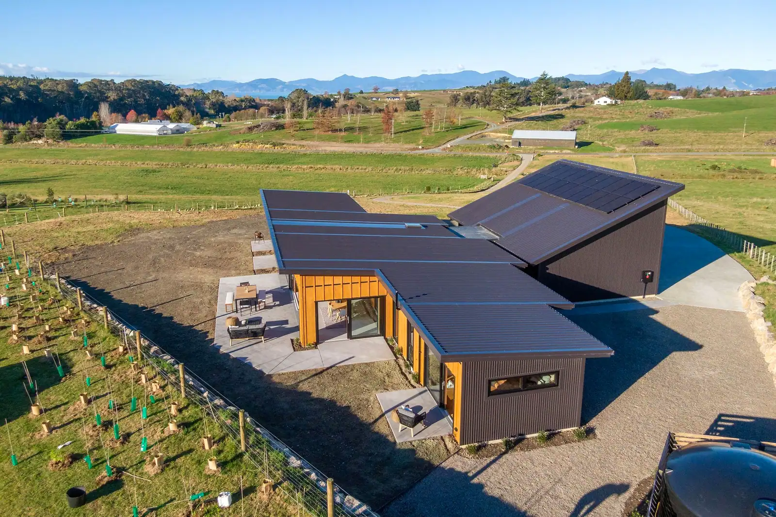 Rooftop solar array powering Horton Road, an energy-efficient Ecotectural SIPs home in Tasman