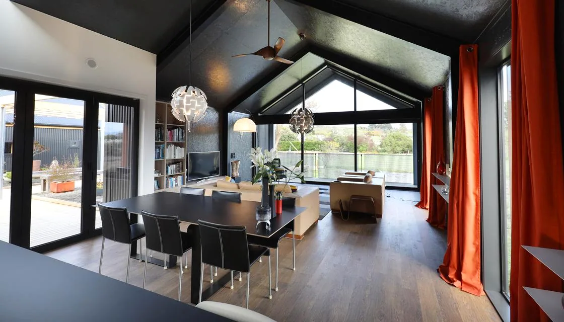 Crafted dark-timber interior of The Black House, the Ecotectural build featured on Grand Designs NZ