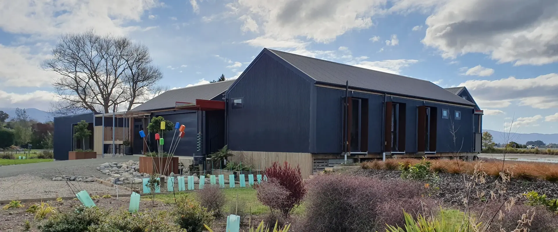The Black House among native planting at Johnstone Loop, Tasman