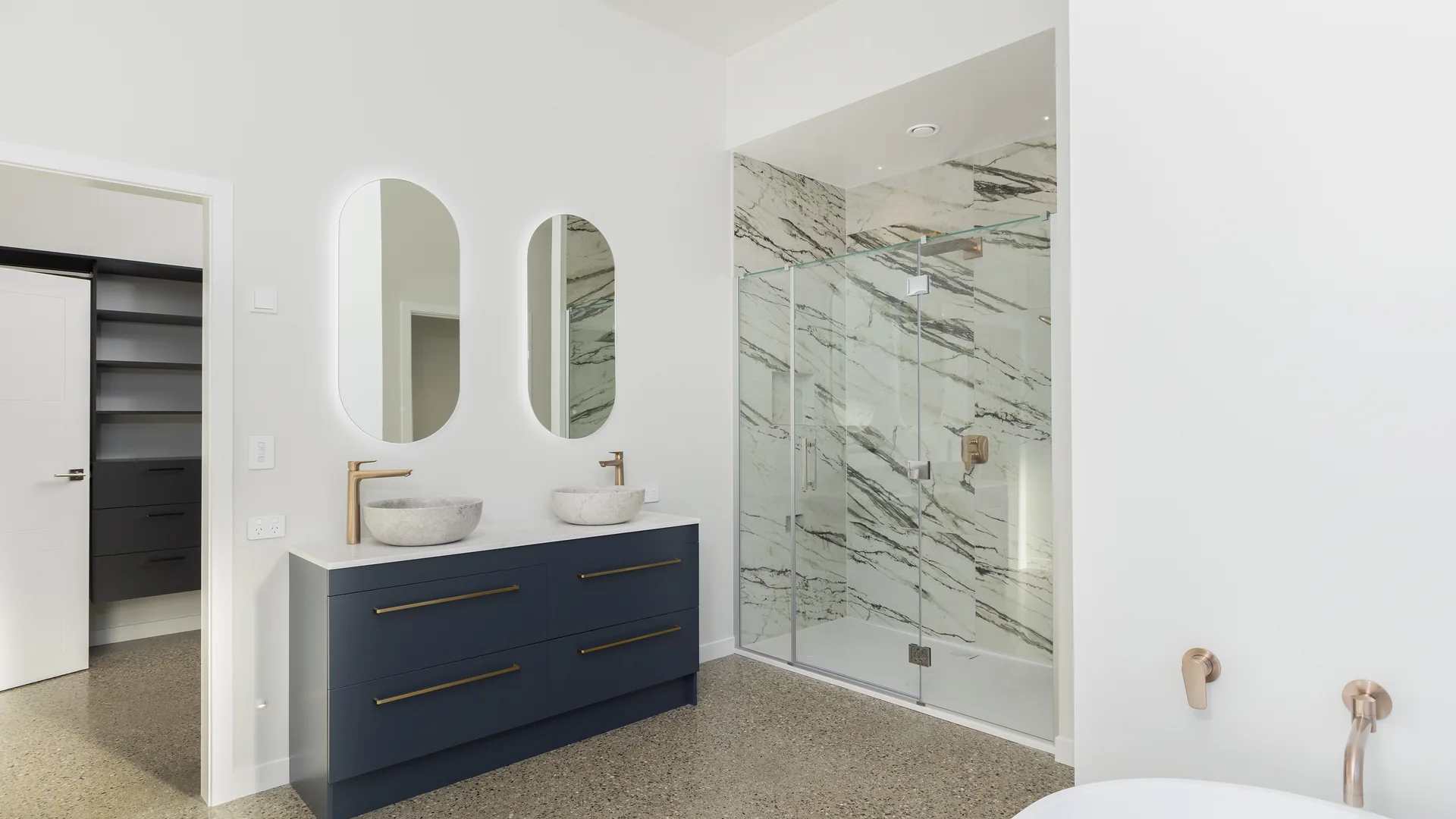 Marble ensuite with twin mirrors and double vanity at The Blue House