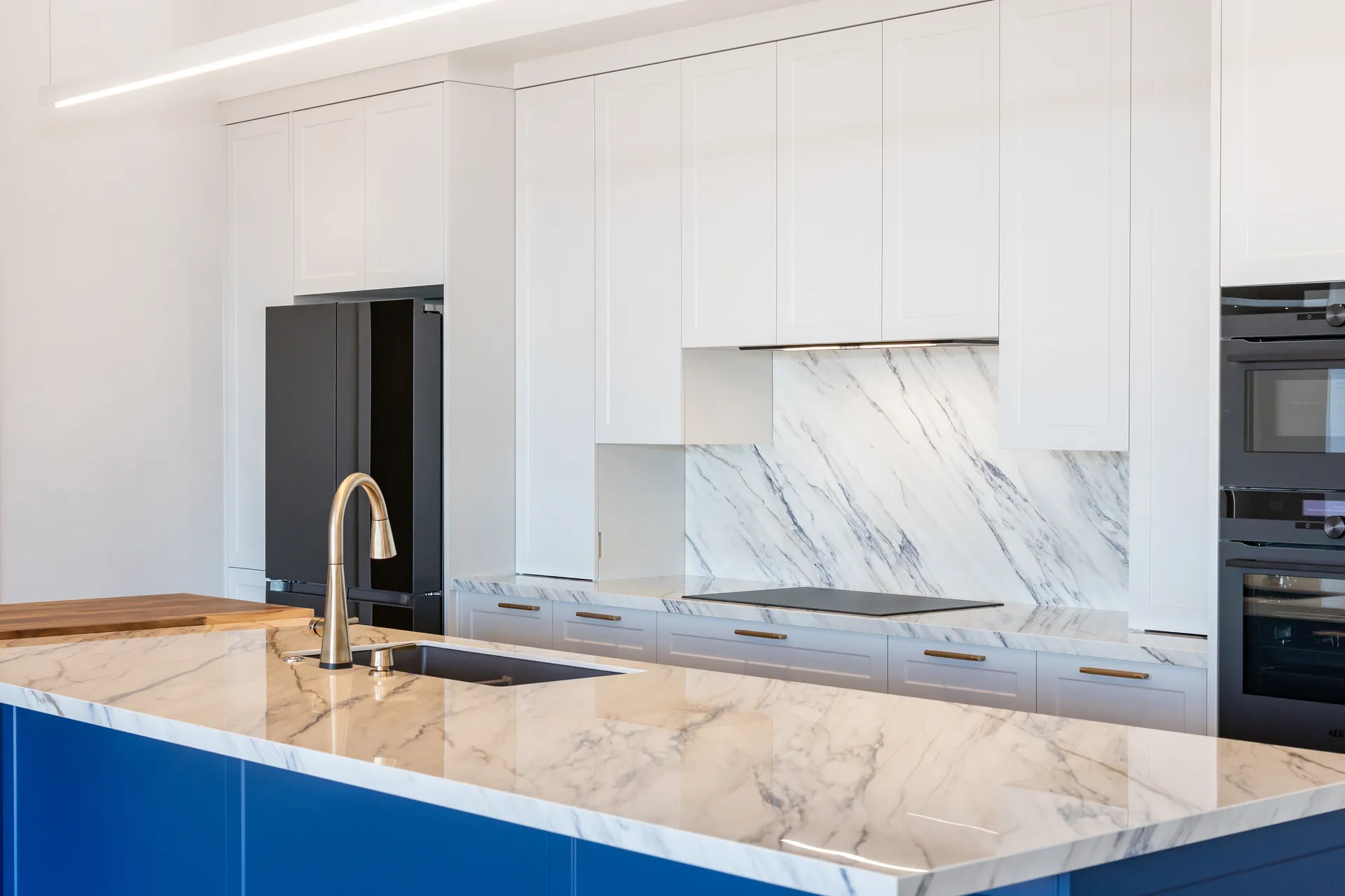The blue kitchen island at the heart of The Blue House, Upper Moutere
