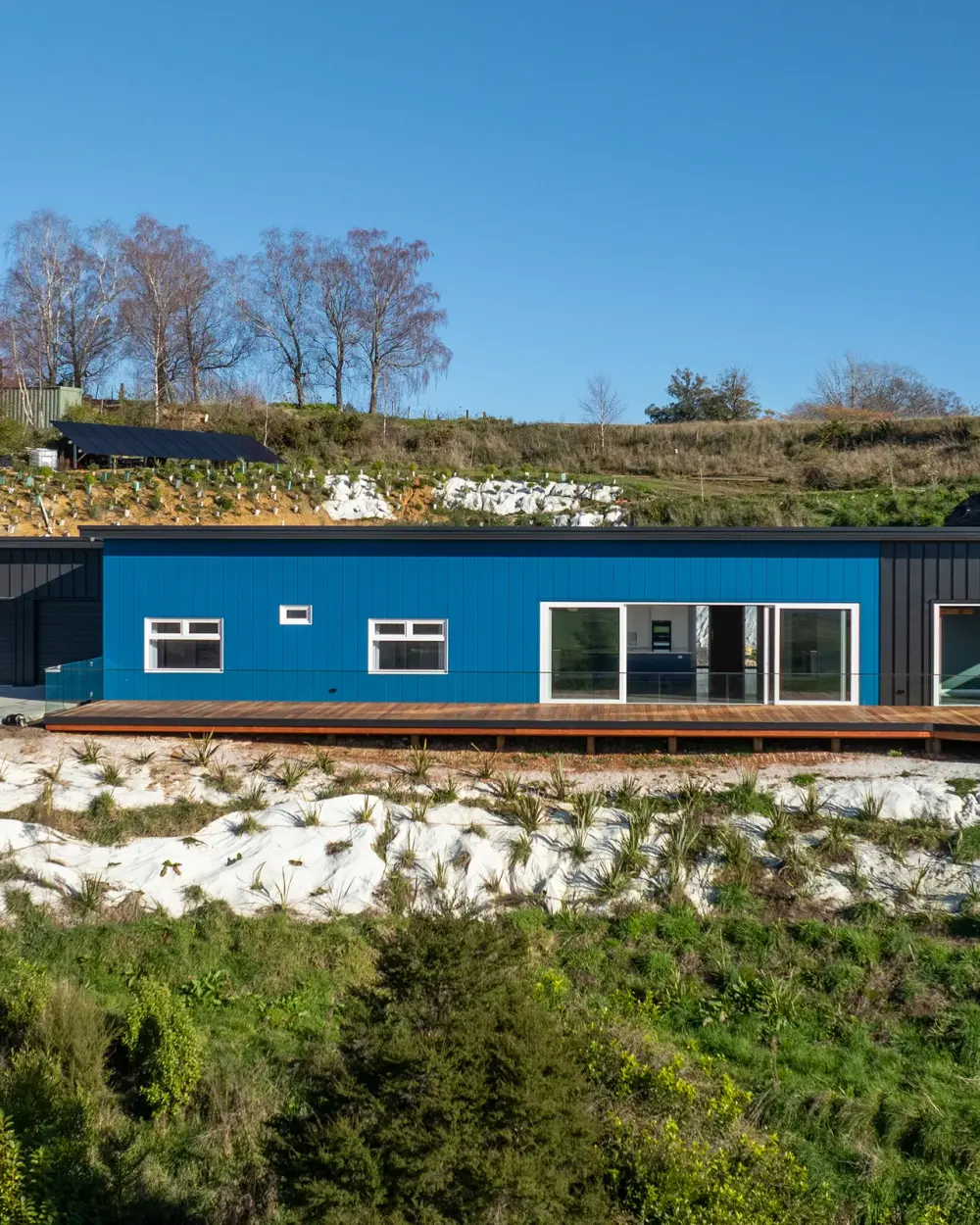 Side elevation of the finished high-performance home, The Blue House