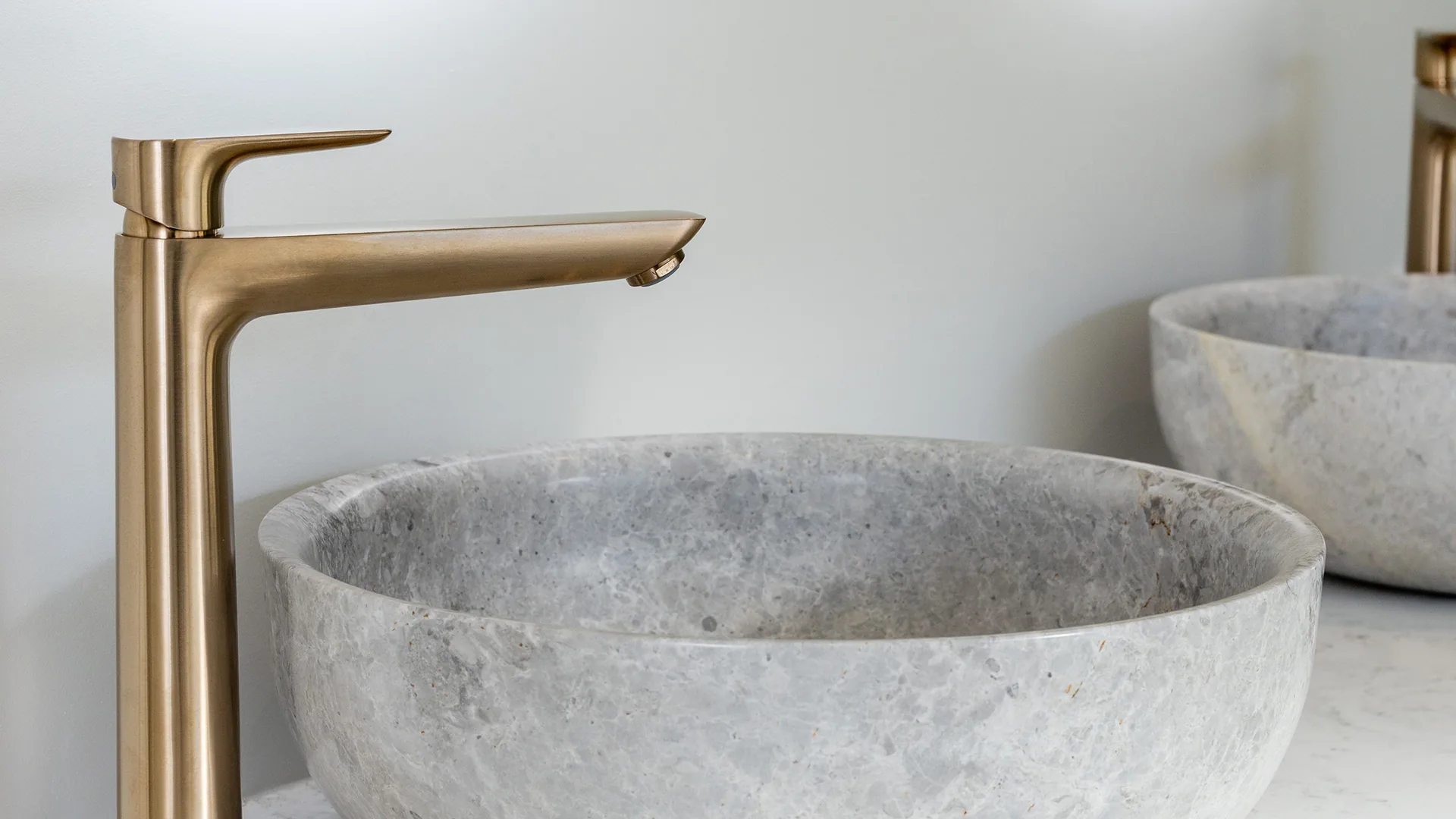 Stone vessel basins and brass tapware on the double vanity, The Blue House, Upper Moutere