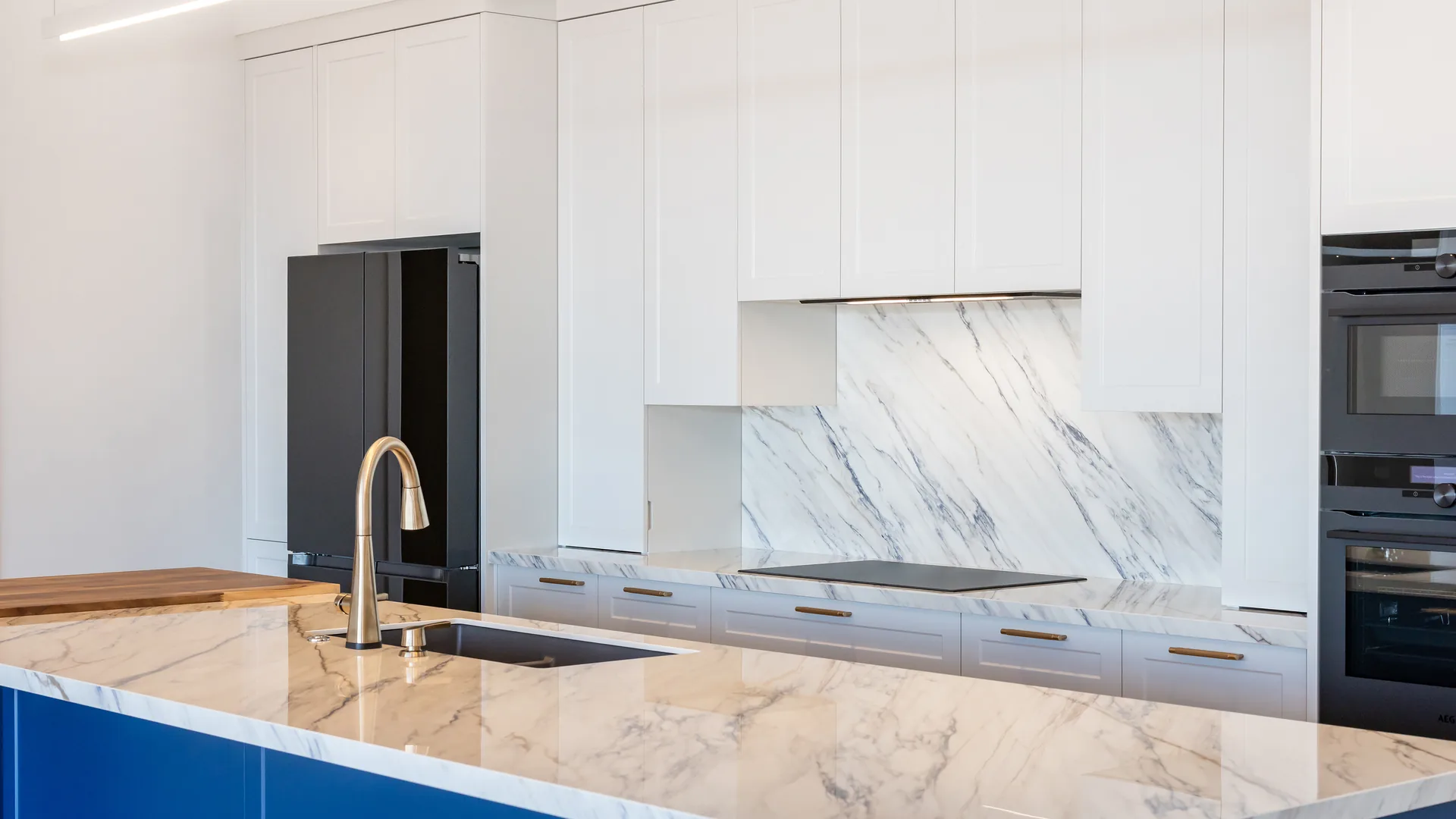 Stone benchtops in the kitchen of The Blue House, Upper Moutere