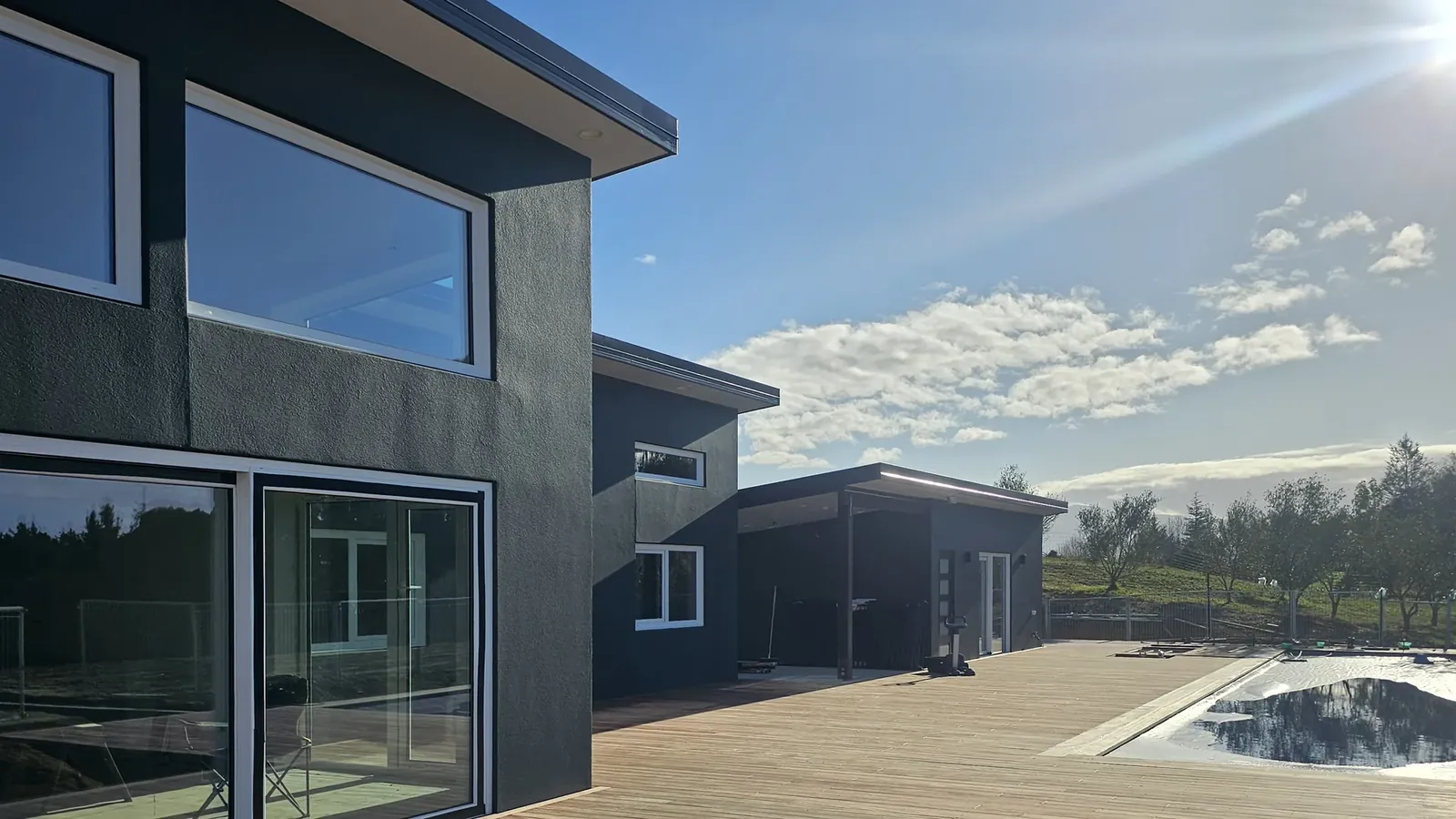 Charcoal facade and cedar deck at Tasman View, Tasman