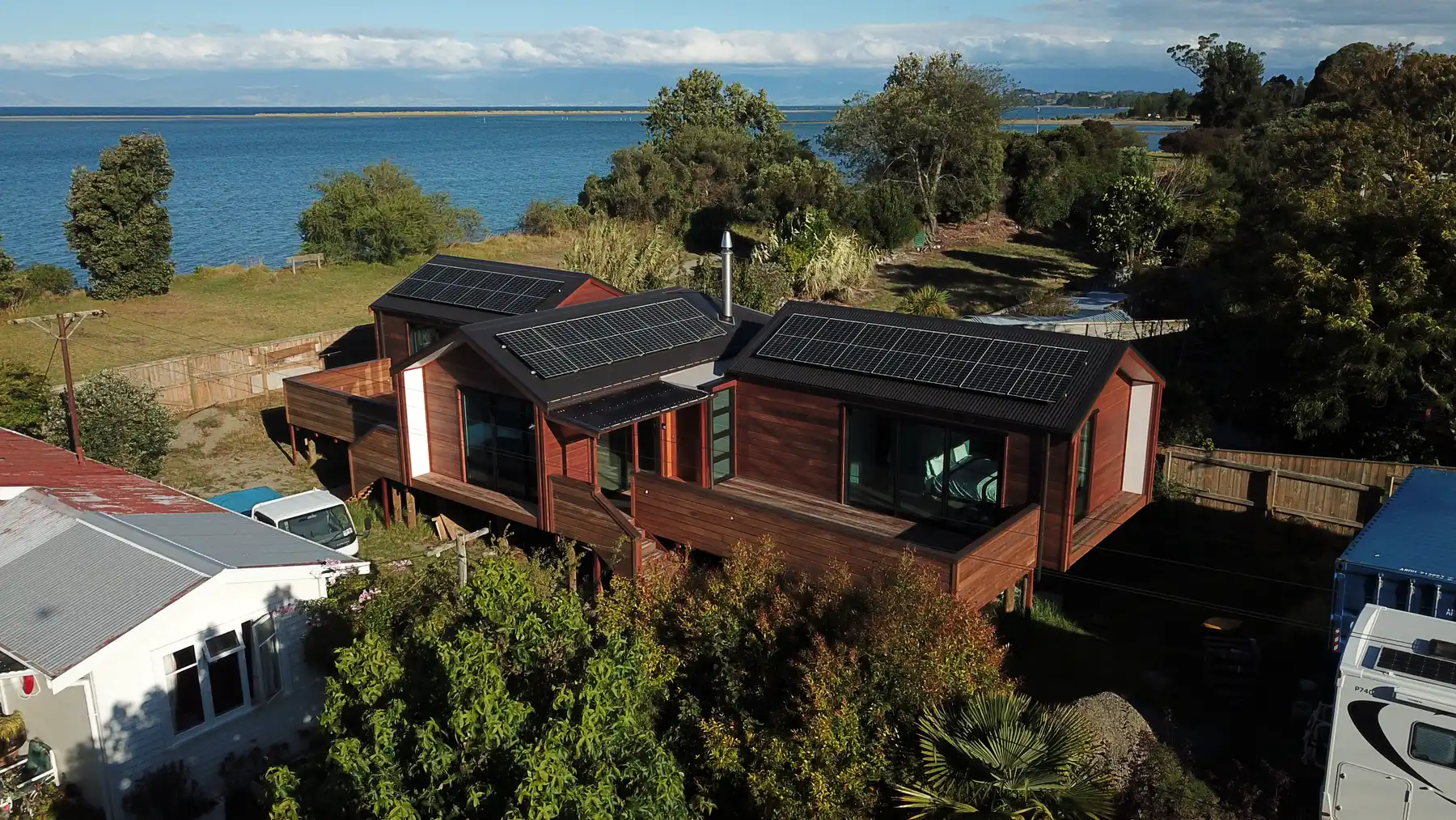 Aerial view of the solar array on the Cedar House, an Ecotectural build above the Motueka estuary
