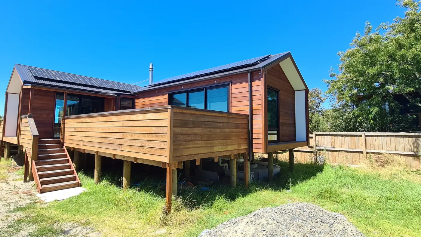 The Cedar House lifted 1.8 metres on timber piles above the Motueka estuary