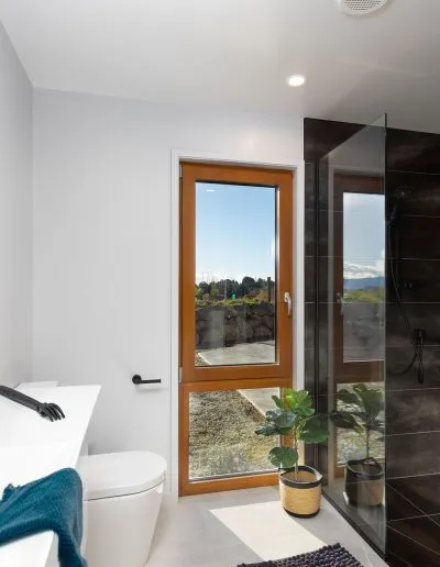 Bathroom with a timber-framed window at Horton Road, Tasman