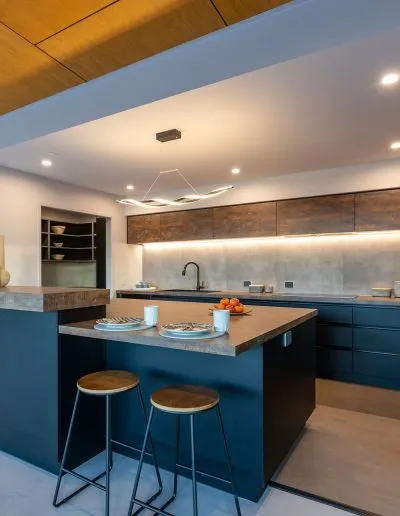 Bespoke kitchen with a blue island at Horton Road, Tasman