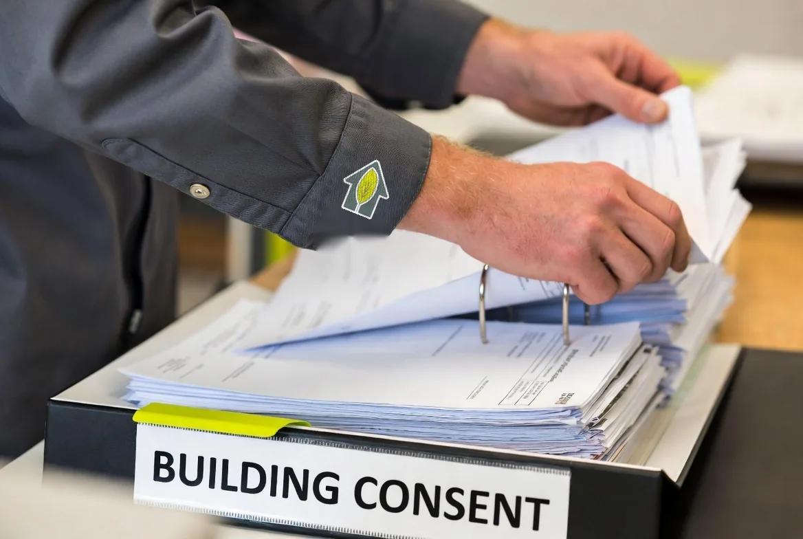 Leafing through the building consent documentation folder