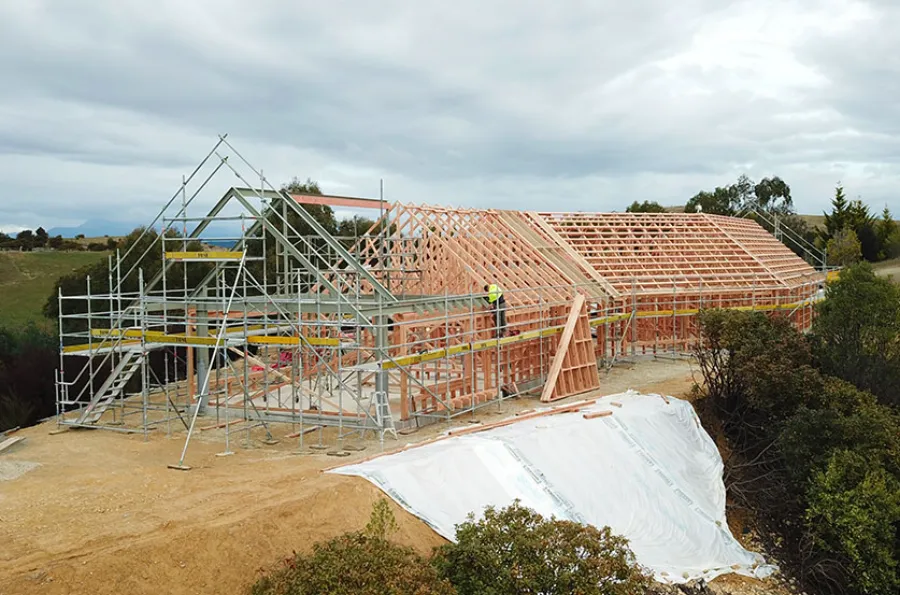 Pre-nail timber frame and roof trusses on a new home